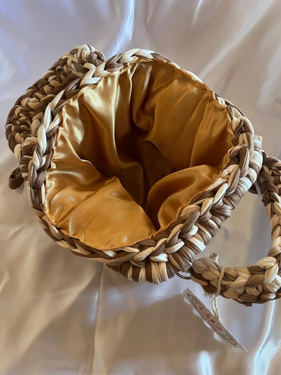 Gold and brown snap clutch
