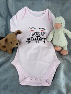 Short-sleeve baby pink baby grow